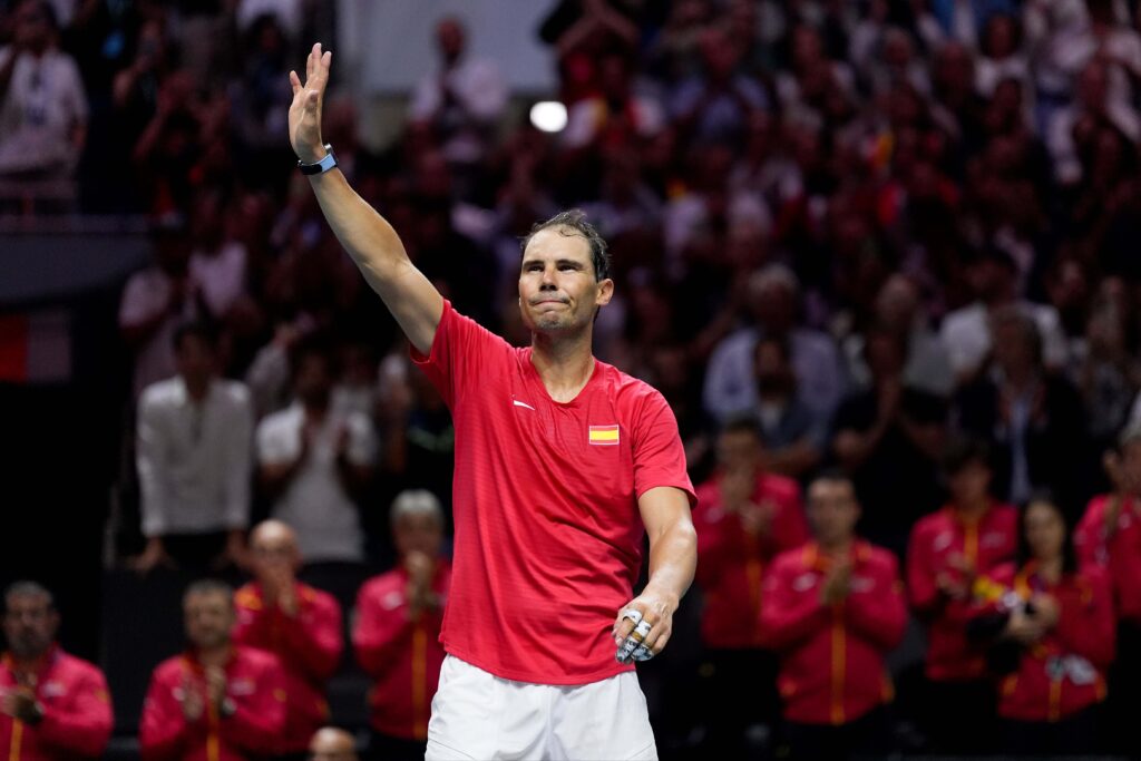 Rafael Nadal, in red, waves to the crowd after his last match at the Davis Cup for Spain against the Netherlands on Monday. Nadal, Federer eyed as future Laver Cup captains for Europe