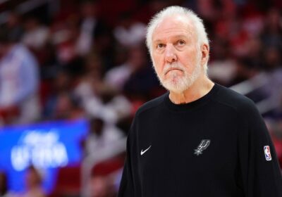 Coach Gregg Popovich ponders a moment at the sideline in a recent NBA game. Popovich recovering from mild stroke, says Spurs