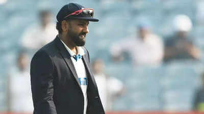 India captain Rohit Sharma, in black suit, ponders his next move in the pitch in file photo. Sharma disappointed India 'failed as a unit' after whitewash vs NZ