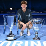 World No.1 Jannik Sinner poses with his two trophies after the final against Taylor Fritz of the US on Sunday. Sinner raises ATP Finals trophy after dropping Fritz in final