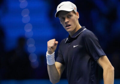 Jannik Sinner pumps his fist and grins in his match against Taylor Fritz in Turin, Italy, on Tuesday. Sinner perfect in ATP Finals before home crowd