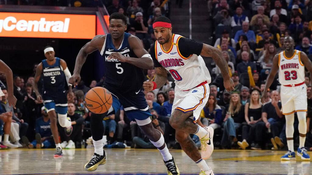 Minnesota guard Anthony Edwards (left, 5), and Golden State guard Gary Payton II (right, 0) try to outrace each other for the ball in the team's matchup on Sunday. Edwards fined USD25,000 for 'profane language