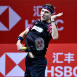 Denmark's Viktor Axelsen (in black and purple shirt) returns a shot in file photo. Axelsen pulls out of World Tour Finals 2024 due to foot injury