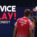 Denmark's Viktor Axelsen (right, in red shirt uniform) stresses a point to the umpire in file photo. BWF to crack down on delaying service in doubles matches