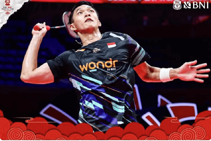 Indonesia's Jonatan Christie, in black uniform, prepares to hit a shot in his match on Thursday. Christie trips Naraoka, gets back on track in BWF World Tour Finals