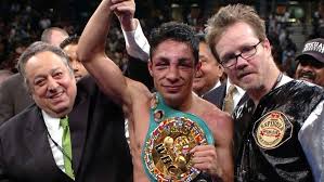 Mexican fighter Israel "El Maginifico" Vazquez (middle) had his hand raised by the late former WBC president Jose Sulaiman (left) and Hall of Fame trainer Freddie Roach (right) in file photo. Vazquez hailed as 'one of the best' after Mexican great dies