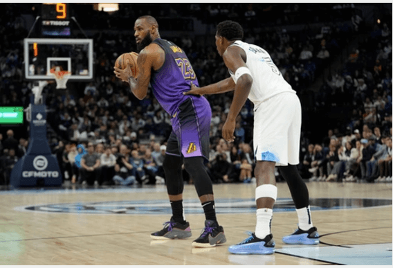 Los Angeles forward LeBron James (23) posts u[p against Minnesota guard Anthony Edwards (5) in their teams' match on Monday. James held down to season-low 10 points as Lakers lose to Wolves