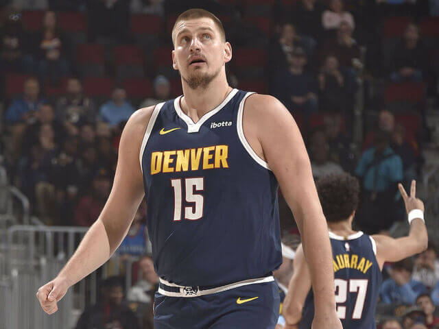 Denver Nuggets center Nikola Jokic (15) walks on the court in his team's match against the Cleveland Cavaliers on Thursday. Jokic passes Magic in triple-double record in Nuggets loss to Cavs