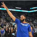 Karl Anthony Towns (in blue shirt) achknowledges the cheers from the crowd at Target Center on Thursday. Towns gets warm welcome, standing ovation in Minnesota return