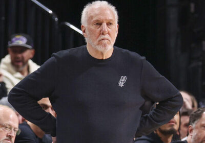 San Antonio coach Gregg Popovich, in black shirt, looks on from the sidelines in file photo. Popovich recovering but 'no timeline' set for Spurs' return: report