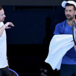 Andy Murray (left) and Novak Djokovic (right) discuss points to ponder while in training in Melbourne. Murray 'absolutely fine' with Djokovic outbursts at Australian Open