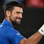 Serbia's Novak Djokovic grins in his match against Portugal's Jamie Faria on Wednesday. Djokovic adds new record