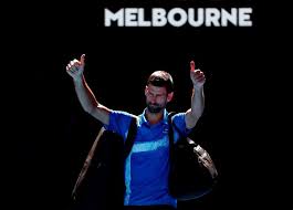 Serbia's Novak Djokovic poses two thumbs up on his fingers after his semifinals match against Germany's Alexander Zverev on Firday. Djokovic retires, booed in Australian Open semis