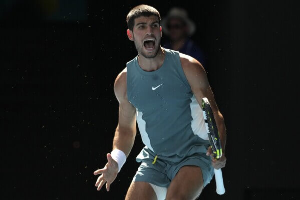 Spain's Carlos Alcaraz lets out a roar  in a match on Sunday. Australian Open quarters feature Djokovic vs Alcaraz