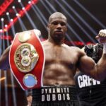 British fighter Daniel Dubois holds his IBF heavyweight title belt in file photo. Dubois vows to 'put a stop' to Usyk's win streak over British fighters