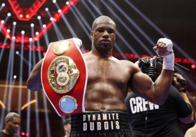 British fighter Daniel Dubois holds his IBF heavyweight title belt in file photo. Dubois vows to 'put a stop' to Usyk's win streak over British fighters