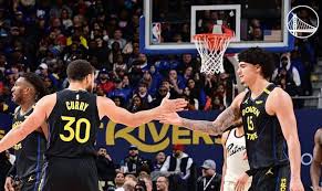 Brazilian guard Gui Santos (right) gets a high-five from teammate Stephen Curry (30, left) in Golden State's match against the Detroit Pistons on Thursday. Santos sparks Warriors in win over Pistons