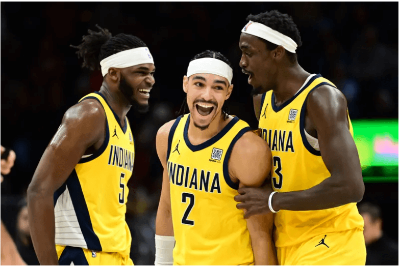 Indiana's Andrew Nembhard (2, middle) celebrates with teammates Jarace Walkere (5, left) and Pascal Siakam (43, right) in the Pacers' match against Cleveland on Sunday. Pacers halt Cavs win run