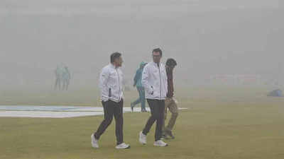 Players and officials walk through the smog in Multan as the toss between Pakistan against West Indies was scheduled on Friday. Pakistan vs West Indies Test delayed due to high pollution levels