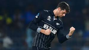 New Zealand captain Mitchell Santner pumps his fist in celebration at a match in this file photo. 's ICC Champions Trophy roster has 'raw pace,' says Santner