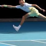 Italy's Jannik Sinner rushes to respon to a shot at the Australian Open on Monday. Sinner wins, Tsitsipas loses in Melbourne