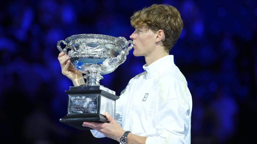 Italy's Jannik Sinner kisses his trophy after winning in the final against Germany's Alexander Zverez in Melbourne on Sunday. Sinner advises Zverev to 'keep believing in yourself' after finals win