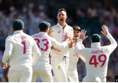 Australia all-rounder Beau Webster (center) celebrates with his teammates after a crucial moment in their match against India. Australia caps 'brilliant night' with beers after win