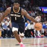 Zion Williamson (1) dribbles the ball in New Orleans' match vs Minnesota on Tuesday. Williamson returns after 27-game absence but Pelicans lose