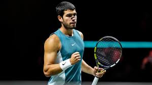 Spaniard Carlos Alcaraz pumps his first in his final match against Alex De Minaur of Australia in Rotterdam on Sunday. Alcaraz 'feeling better' after winning Rotterdam Open title