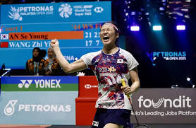 South Korea's An Se-young pumps her first with a roar at a recent tournament in file photo. China's Shi Yu Qi raises his arms in celebration at a recent tournament in file photo. Shi, An continue to lead latest BWF rankings