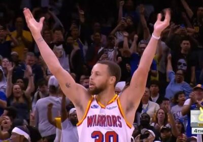 Golden State Warriors' guard Stephen Curry aises his hands in celebration after his amazing night ibn Orlando on Thursday. Curry drops 56 points, 12 3s in Warriors' win over Magic