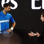 Serbia's Novak Djokovic (left) and Britain's andy Murray (right) discuss strategy at a recent Australian Open match in file photo. Djokovic sticks with Murray as coach indefinitely, loses at Qatar