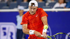 Denmark's Holger Rune braces to return a shot at a US Open 2024 match in file photo. Fritz, Rune may play US Open mixed doubles after format change