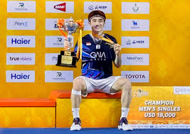 Singapore's Jason Tehsits with his trophy after his final match in the men's singles on Sunday. Pornpawee, Jason claim Thailand Masters 2025 singles titles