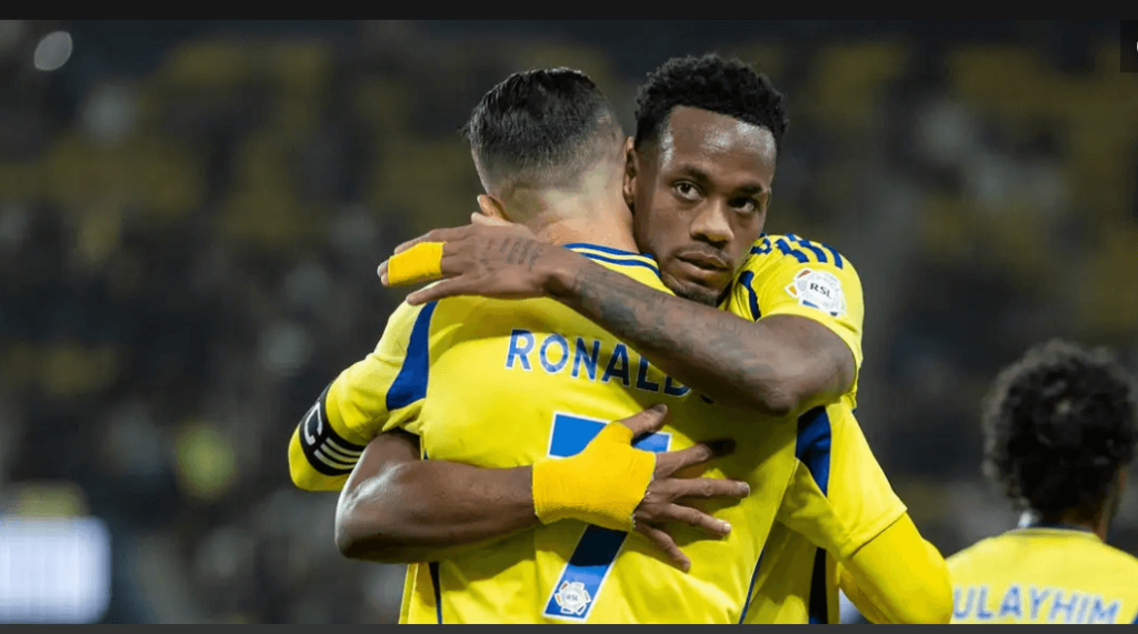 Al Nassr Jhon Duran (right) huges teammate Cristiano Ronaldo (7) in celebration in his team's match against Al Ahli at the Saudi Pro League on Thursday. Al Nassr beat Al Ahli as Ronaldo allows Duran to take spotlight