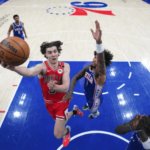 Chicago Bulls guard Josh Giddey (left, 3), drives for a layup against Philadelphia 76ers' forward Kelly Oubre(right) during their match on Monday. 76ers vs Bulls marks another missed game for Embiid