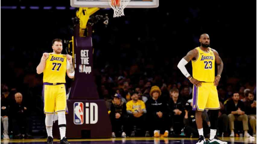 New Los Angeles Lakers guard Luka Doncic (left) stands alongside teammate LeBron James (right) in their team's match against the Utah Jazz on Monday. Lakers welcome Doncic with win over Jazz; 'Luka Magic' shines