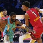 Team Shaq guard Kyrie Irving of the Dallas Mavericks (left) dribbles against Tewam Chuck Global Stars' Victor Wembanyama of the San Antonio Spurs (right) at the NBA All-Star Game 2025 in Oakland, California, on Sunday. NBA All-Star Game open for USA vs World matchup for 2026