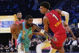 Team Shaq guard Kyrie Irving of the Dallas Mavericks (left) dribbles against Tewam Chuck Global Stars' Victor Wembanyama of the San Antonio Spurs (right) at the NBA All-Star Game 2025 in Oakland, California, on Sunday. NBA All-Star Game open for USA vs World matchup for 2026