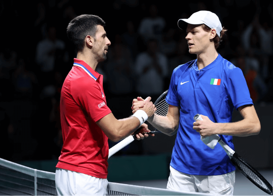 Serbia's Novak Djokovic shakes hands with Italy's Jannik sinner at center court at a tennis match in file photo. Djokovic says players have 'lack of trust' in WADA after Sinner ban