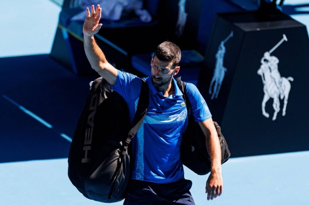 Serbia's Novak Djokovic wavs to the crowd after he retired in his match at the Australian Open last month in file photo. Djokovic eyes Qatar Open return, seeks 100th singles title