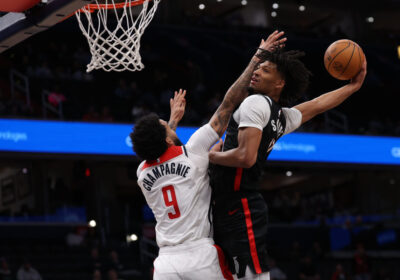 Portland's Shaedon Sharpe (right) soars for a dunk over Washington forward Justin Champagnie (right) in their game on Wednesday. Sharpe's vicious dunk caps 36-point night as Blazers drop Wizards