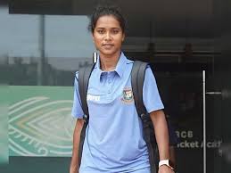 Bangladeshi women's cricketer Shohely Akther poses for the media with her bag as she leaves a facility in file photo. Akther first female cricketer banned by ICC for corruption charges