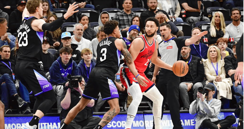 Newly acquired Clippers guard Ben Simmons posts up against Utah guard Keyonte George (3) while Lauri Markannen (23) is ready to double team in their game on Thursday. Simmons gets props from Harden, Leonard, fans in Clippers' win