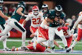 Players from the Kansas City Chiefs (in white) and the Philadelphia Eagles (green) grapple for possession at the Super Bowl LIX in New Orleans, Louisiana, on Sunday. Super Bowl LIX meme compares title game to Messi, Ronaldo fame