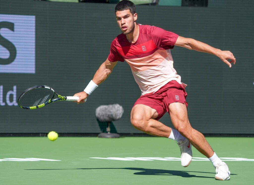 Spain's Carlos Alcaraz gets ready to hit a shot at a match in Indian Wells in file photo. Alcaraz cruises through Indian Wells' final 16