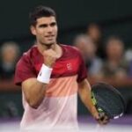 Spain's Carlos Alcaraz pum[s his fist in his match at Indian Wells on Wednesday Alcaraz, Keys advance to Indian Wells last 8