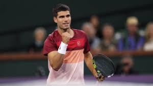 Spain's Carlos Alcaraz pum[s his fist in his match at Indian Wells on Wednesday Alcaraz, Keys advance to Indian Wells last 8