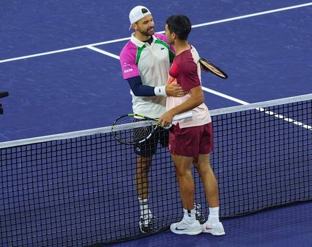 Spain's Carlos Alcaraz (right) shakes hands with Bulgaria's Grigor Dimitrov (right() in their match at Indian Wells on Wednesday Alcaraz, Keys advance to Indian Wells last 8