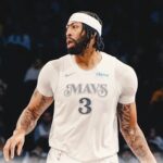 Anthony Davis runs to the court as he made his return on the road in Brooklyn on Monday. Davis returns for injury-hit Dallas, helps Mavs beat Nets